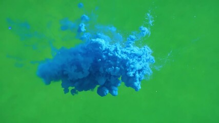 Poster - Vibrant Ink Cloud on green: Mesmerizing display of liquid ink mixing dynamically in water, creating a cloud of vibrant blue against a vivid green background. A splash of color and movement.