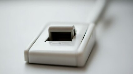 Poster - A close-up view of a computer mouse sitting on a table, ideal for use in technology-related projects or as a design element.
