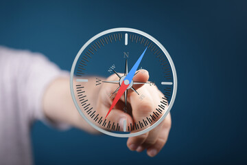 Aufkleber - Person interacts with a virtual compass, symbolizing direction, navigation, and strategic planning.