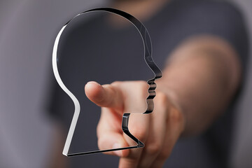 Aufkleber - Abstract image of a hand pointing at a head, symbolizing ideas, focus, and human potential.