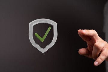 Poster - High-quality image of a digital shield with a checkmark, symbolizing data security and approval.