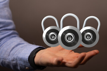 Poster - Image of three digital padlocks on an open hand, symbolizing data protection and cybersecurity.