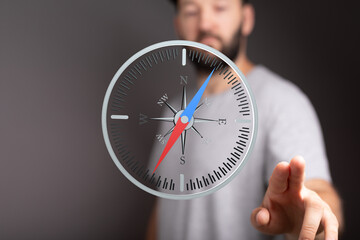 Aufkleber - A man interacts with a digital compass, symbolizing guidance and decision-making.