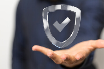 Poster - High-quality image of a hand holding a digital shield, symbolizing data protection, online security, and safety.