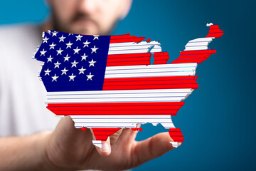 Poster - Person holding a digital map of the USA designed with American flag colors.  Patriotic graphic.