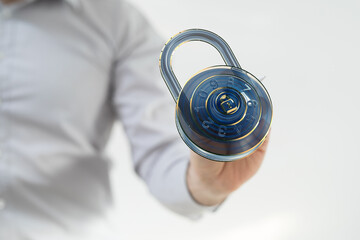 Poster - Image of a hand holding a digital combination lock, symbolizing online security and data protection.