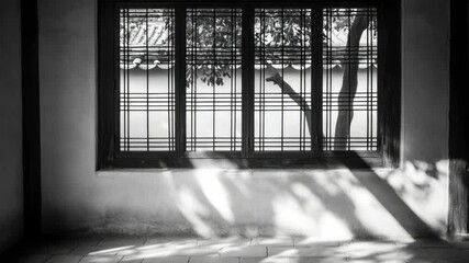 Aufkleber - A black and white photo of a window in a building