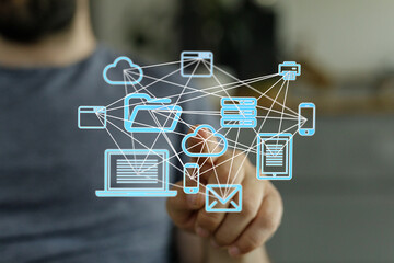 Leinwandbilder - Man interacts with a digital network, showcasing cloud computing, data storage, and file sharing.