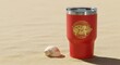 © Eko - Red tumbler featuring gold Pig zodiac, placed on sandy surface with seashell, styled in rule of thirds layout