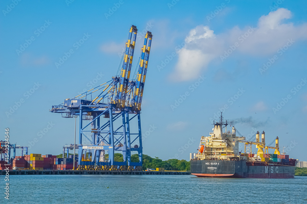 Cargo containers loading on cargo ship at container terminal at port ...