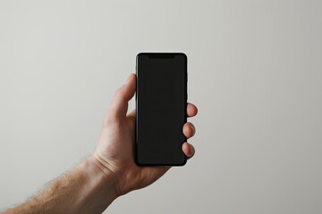 Male Hand Holding a Smartphone with a Black Screen on a White Background