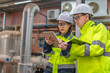 © reewungjunerr - Maintenance technician at a heating plant,Petrochemical workers supervise the operation of gas and oil pipelines in the factory,Engineers put hearing protector At room with many pipes