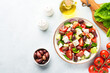 © nadianb - Greek salad, healthy food, mediterranean diet. Fresh vegetables, cheese and olive oil.