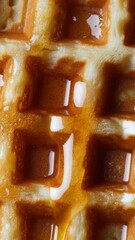 Aufkleber - A close-up shot of a waffle covered in sweet syrup, perfect for breakfast or brunch