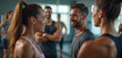 © Pete - Group of fit people at gym with coach. Smiling people, talking about workout program, training together. Friends communicate about sport activity in health club. Teamwork, support, healthy lifestyle.