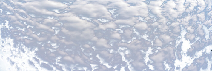 Wall Mural - Panorama of puffy white summer clouds with a transparent sky
