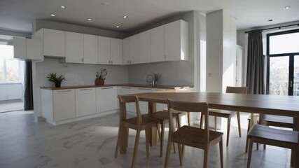 Poster - Bright minimalist kitchen featuring wooden dining table, white cabinet, marble floor, natural light, modern decor, serene dining