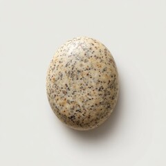 Poster - Speckled Natural Stone Egg on Light Background for Creative Projects