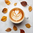 © Dariya - Warm Autumn Latte Art with Falling Leaves on White Background