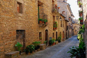  A typical street in Ainsa, a town at the foot of the Pyrenees Mountains in Aragon. The architectural style typical of the region has been preserved in Ainsa