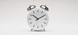© Olha - The elegant white alarm clock representing time and punctuality in modern decor.