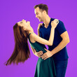 © vgstudio - Love, dating, sales concept - hug embracing or dancing expressive emotional very happy couple, looking at each other. Man, woman isolate purple background. Square image