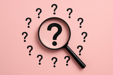 Poster - A magnifying glass highlights a bold question mark against a pink background symbolizing inquiry and critical analysis in business