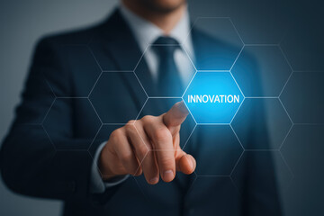 Poster - A business professional in a dark suit emphasizes innovation by actively engaging with futuristic digital concepts to drive progress