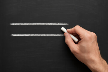 Poster - Creating clear boundaries and focus the draws parallel lines on a chalkboard symbolizing structure and direction in business planning