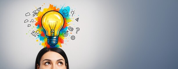 Poster - Woman looking up at colorful light bulb with creative icons on gradient background, concept of ideas and innovation with copy space on right side.
