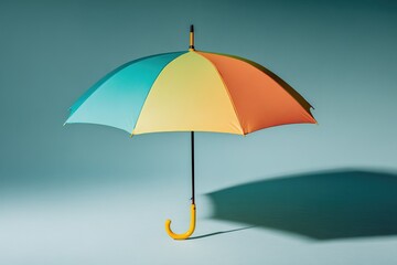 Poster - Colorful umbrella displayed on a simple background showcases vibrant design and playful hues in an artistic setting