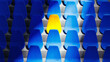 © ADDICTIVE STOCK - Bright yellow stadium seat stands out among blue chairs in isolation