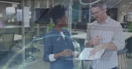 Poster - Business colleagues pointing laptop screen, explaining data, woman nodding and gesturing reply