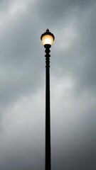 Poster - Black and white photo of a street light at night, suitable for use in urban or nighttime scenes