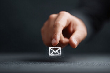 Poster - Finger touches a glowing email icon. Concept for communication, message, online service, contact. Suitable for web, marketing, technology and business contexts.