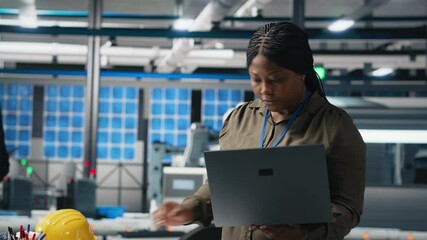 Poster - woman master engineer examining production line for photovoltaics, reviewing manufacturing process d