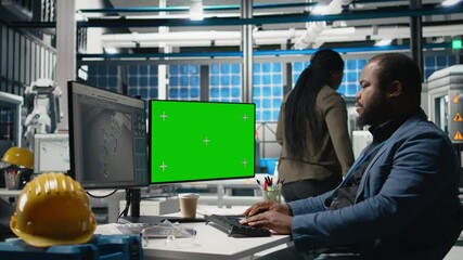 Poster - solar power specialist works on manufacturing strategy next to mockup, combining industrial insight 