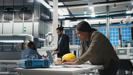 Poster - african american industrial inspector in solar energy reviews data on papers, inspecting production 