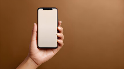 Poster - Hand Holding Smartphone Mockup with Blank Screen on Brown Background