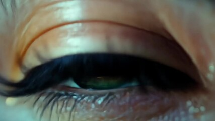 Poster - Close-up of a mesmerizing blue eye with intricate golden details reflecting light and color in a dramatic fashion