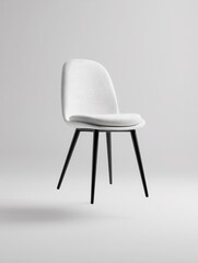Poster - A minimalist chair with a white cushion and black legs, floating on white.