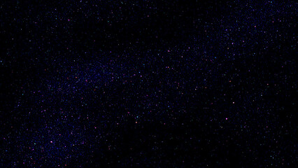 Wall Mural - Starry night sky colourful glitter light sparkle background. Dark blue night galaxy space. Glowing stars. New Year, Christmas and Celebration background concept.