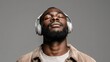 © CStock - Relaxed man enjoying music with headphones, experiencing bliss, and immersing in personal moments of joy and peace.