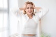 © Pixel-Shot - Stressed mature woman with headache at home