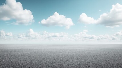 Wall Mural - A vast, calm ocean under a blue sky filled with fluffy white clouds stretching to the horizon.