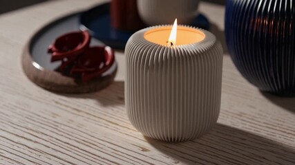 Poster - Minimalist candle decor with white ribbed ceramic candle, cozy warm ambiance, modern table setting, serene mood, modern white