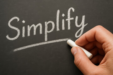 Poster - The concept clarity and focus in business is illustrated by a underlining a key principle written in white chalk on a dark surface