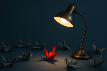 Poster - Innovation and focus illuminate growth as a vintage desk lamp casts light on a single red origami crane among grey birds symbolizing distinctiveness and leadership in business
