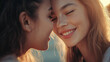 © Evialina - Young women smiling and bonding closely at sunset