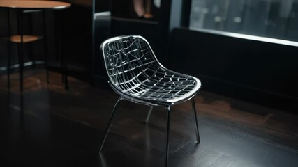 Poster - A chair sitting on a hardwood floor, ideal for use in interior design and furniture images